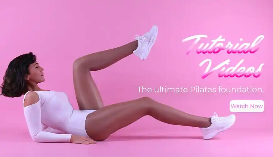 Lisa performing a Pilates exercise in pink sportswear, emphasizing her fitness and choreography skills.